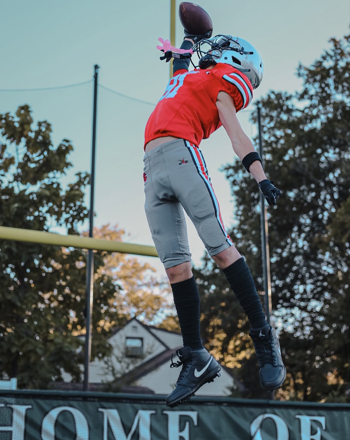 Low-angle action shot of a Stars receiver high-pointing the football mid-air