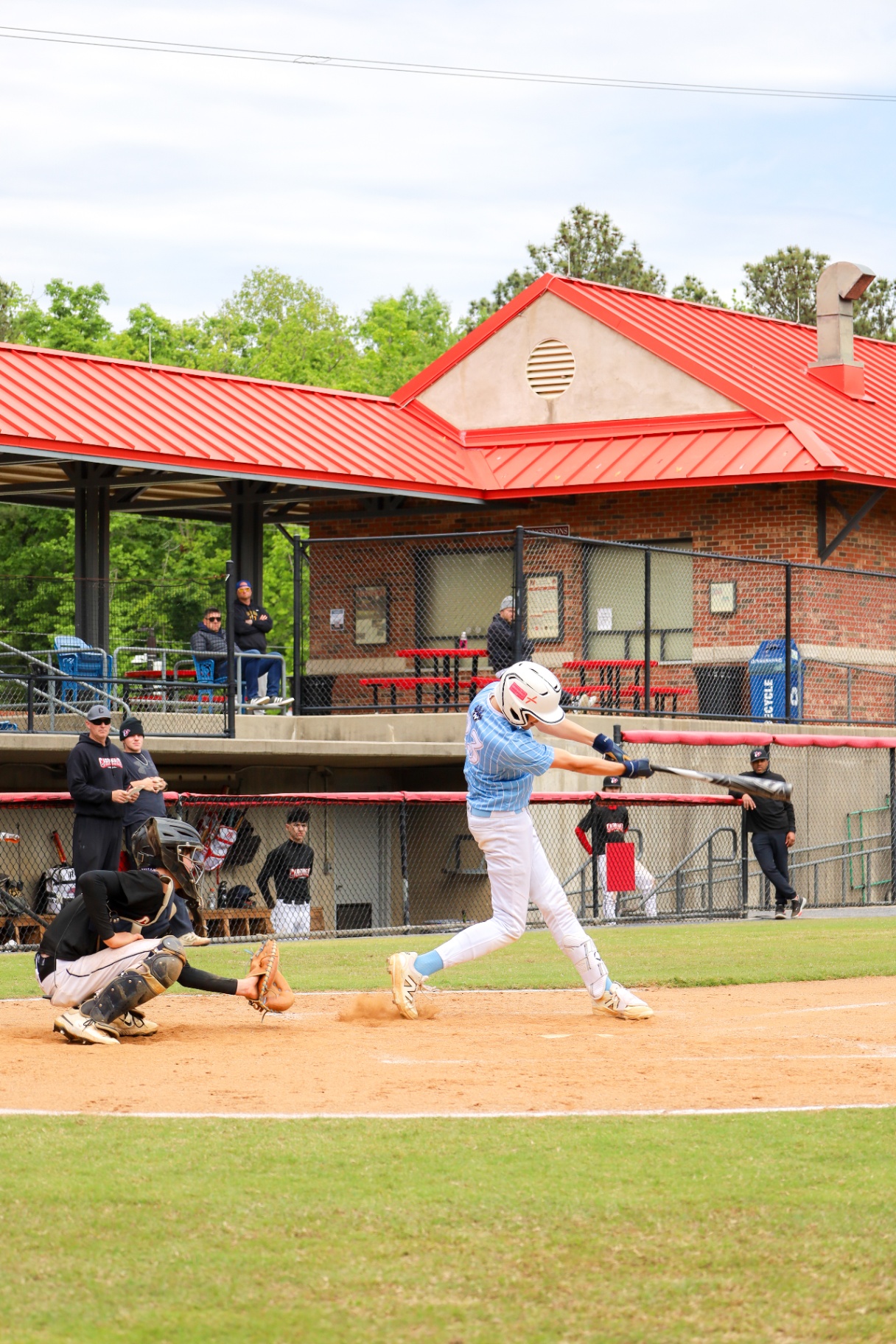 Batter connecting with the ball during a youth baseball game