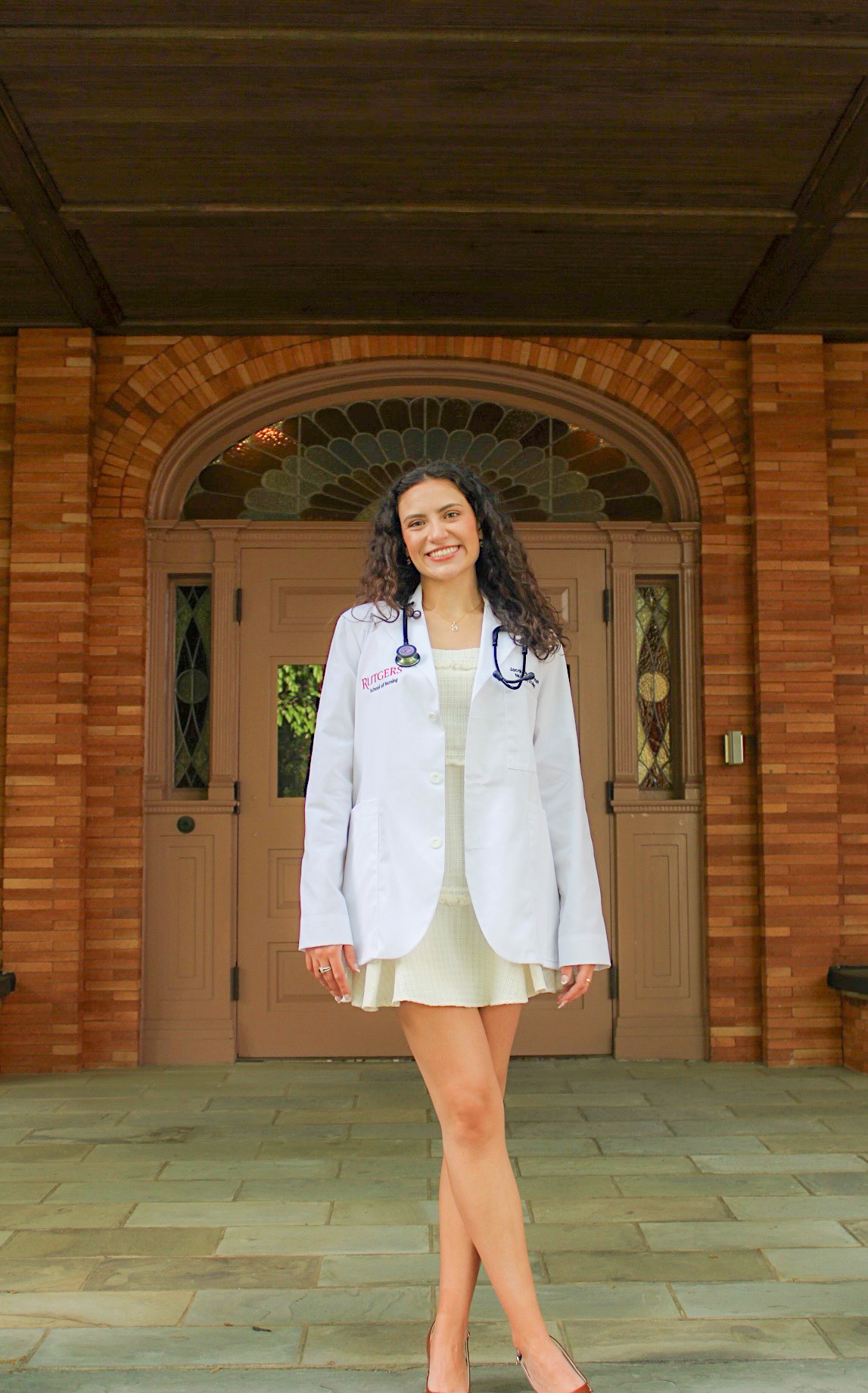 Rutgers School of Nursing white coat portrait